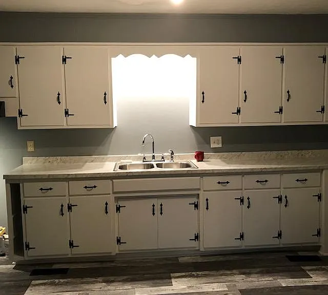 Kitchen with lots of cabinets. Deep sink.