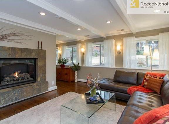 Custom designed fireplace in family room has electronic controls