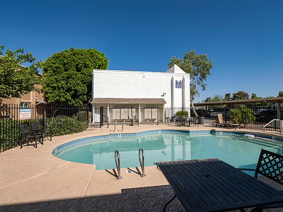Pool and poolside area at Fairway Vistas Condominiums.