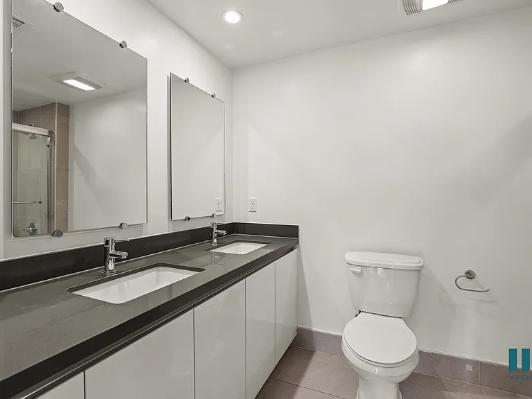 Bathroom with Double-Sink Vanity and Cabinet Storage
