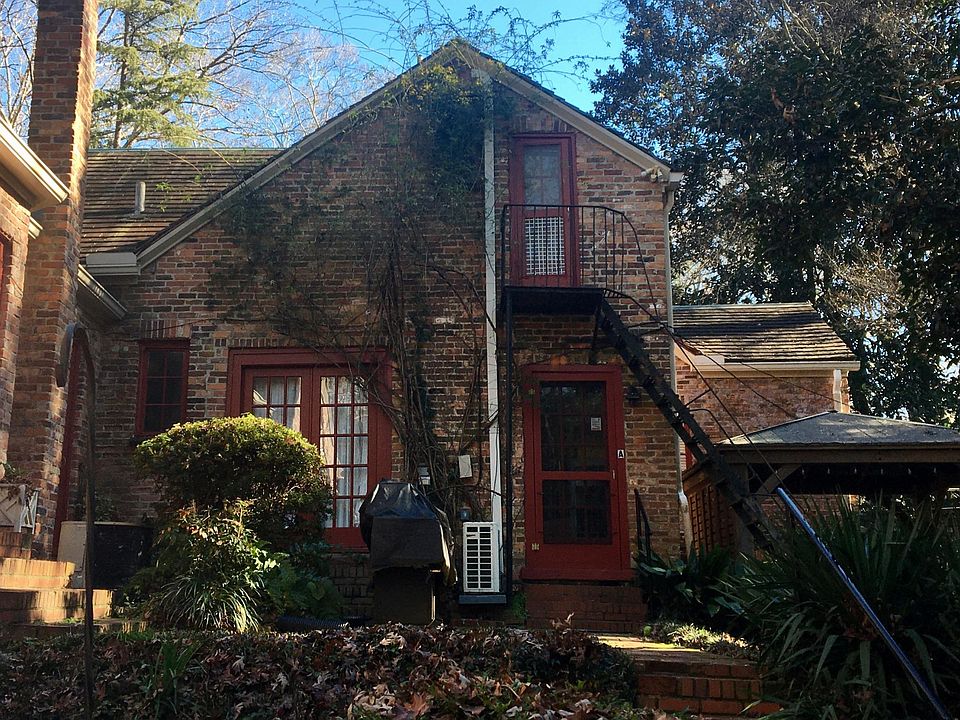 Doorway leading to the A unit with the Gazebo to the right. The doors and paths are well lit with landscaping and motion lights.