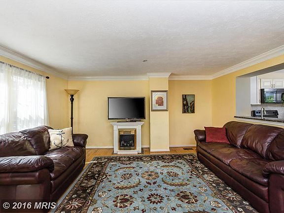 Living room has large front window for a light