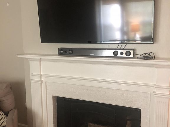 60" TV over mantle in living room is negotiable.