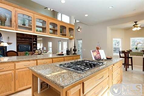 A chef's delight! Kitchen has storage space and impressive appliances.