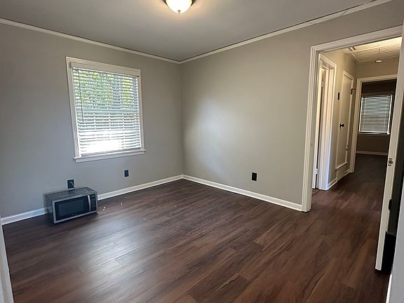 Dining room just off kitchen to one side and hall to bedrooms on the other side.