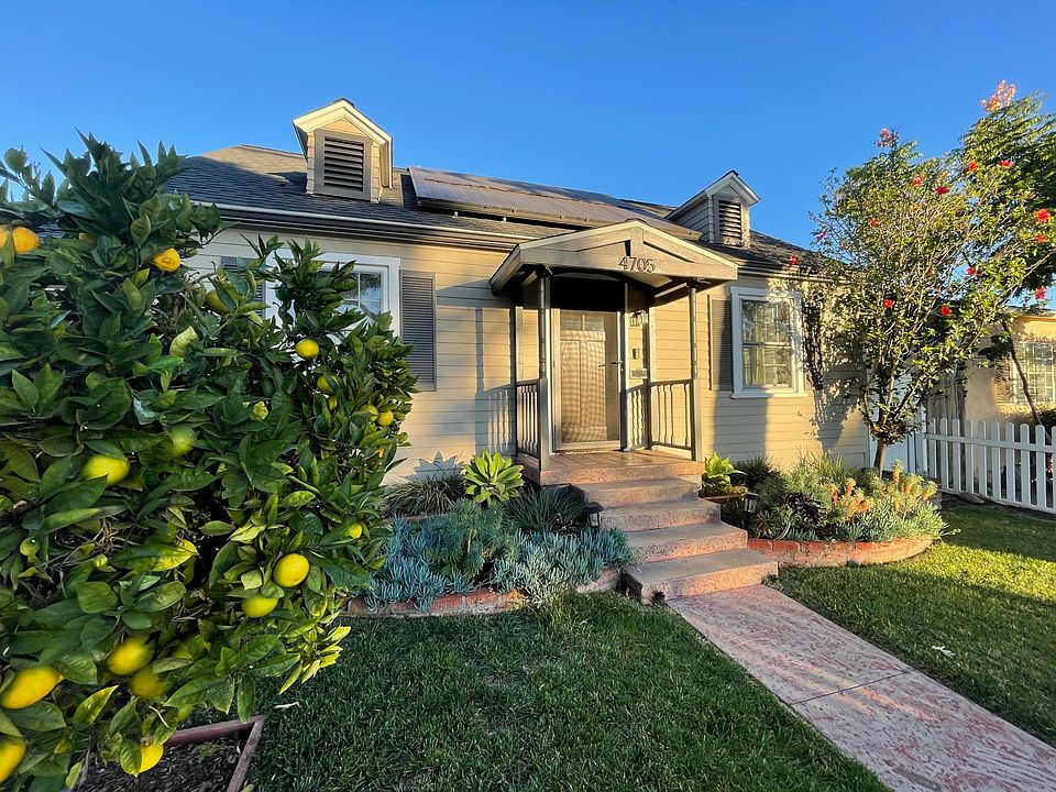 Mature orange tree in front yard, whole house painted on exterior and new gutters in Aug 2021.