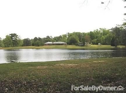 View of the back of house taken from across the lake.