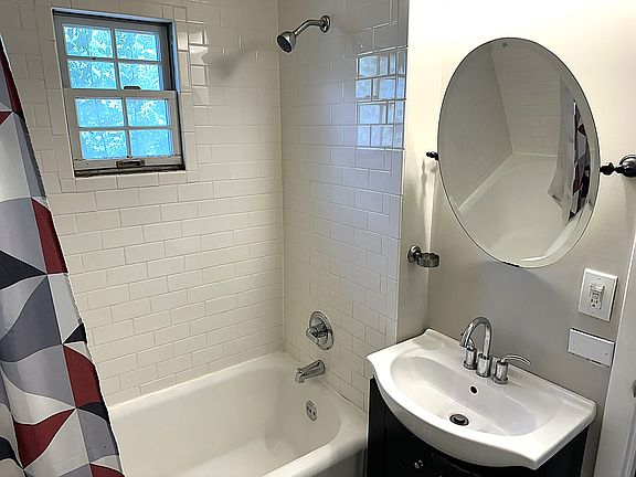 Full Bath with subway tile surround