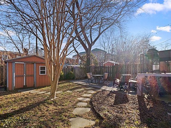 backyard with shed, fully fenced rear yard.