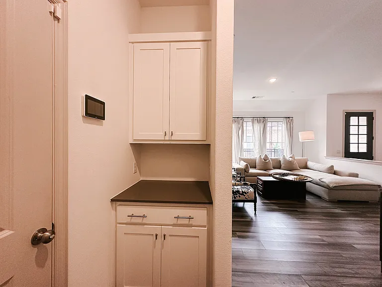 Entry from the garage with extra storage across from laundry room
