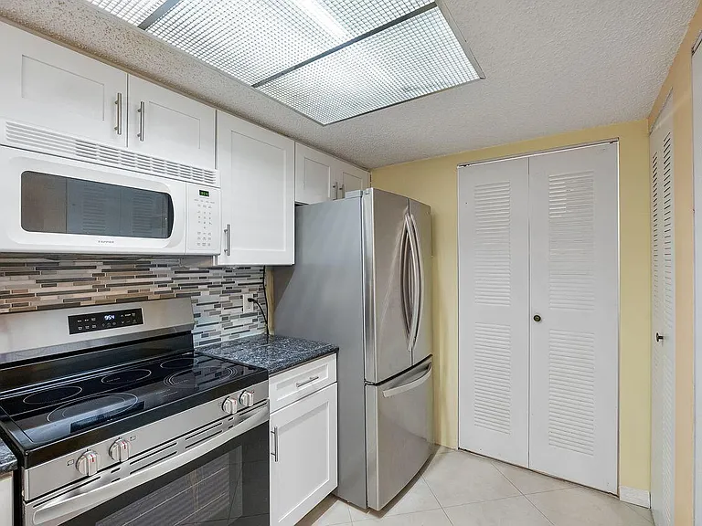 5011 Wiles Rd #303 — Photo 15