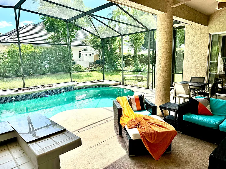 Outdoor summer kitchen, TV, pool area