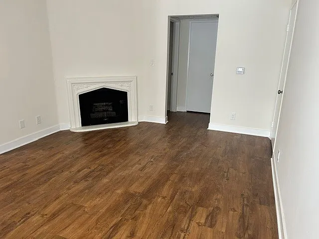 Living room with fire place, coat closet, and walk out patio