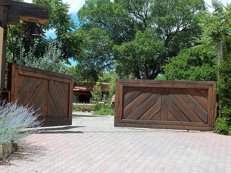 ABSOLUTELY PRIVATE AND SECURE. 
Enter these gates by remote control into a private Sanctuary covered with trees and gardens