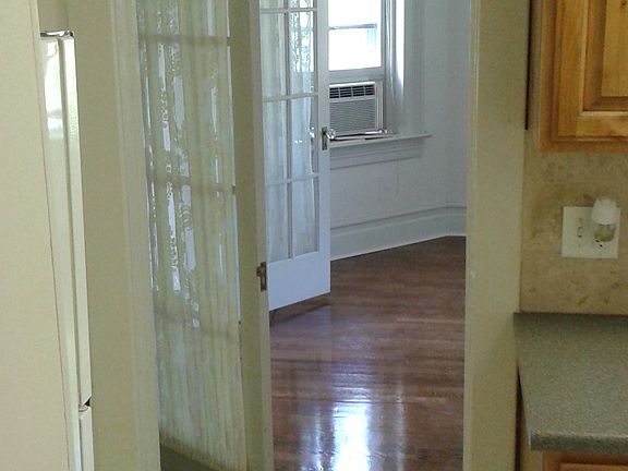 beautiful interior window paned doors separate living areas inside the apartment