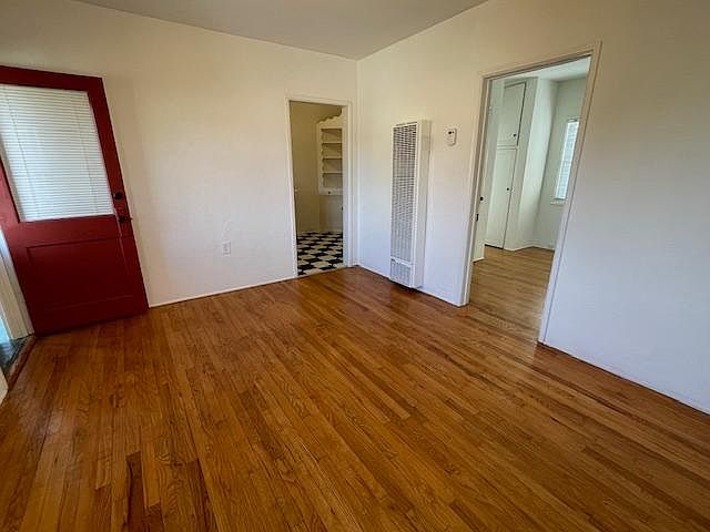 Living room looking into kitchen and bedroom.
