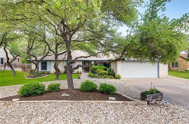 Charming curb appeal with protected front porch and plenty of parking