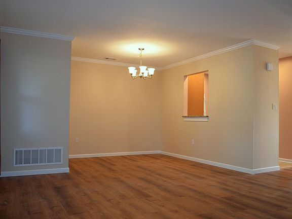 Spacious dining room flows into living room.