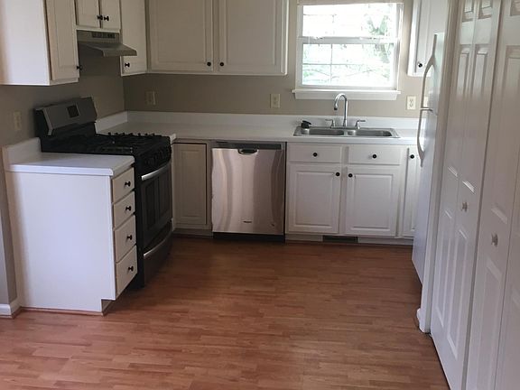 Kitchen with hardwood laminate floors.