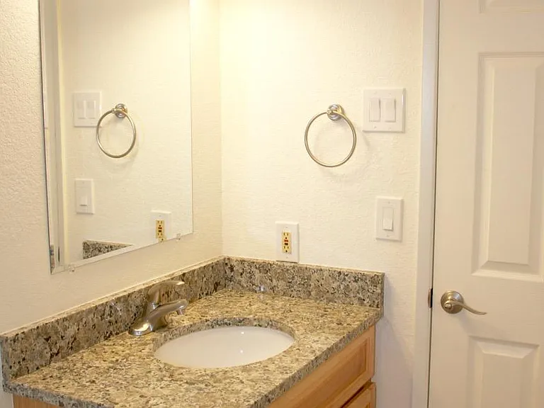 Bathroom updated in 2018, with new hickory vanity, new granite countertop, new satin nickel faucet. New LED light fixtures. New bath accessories.
