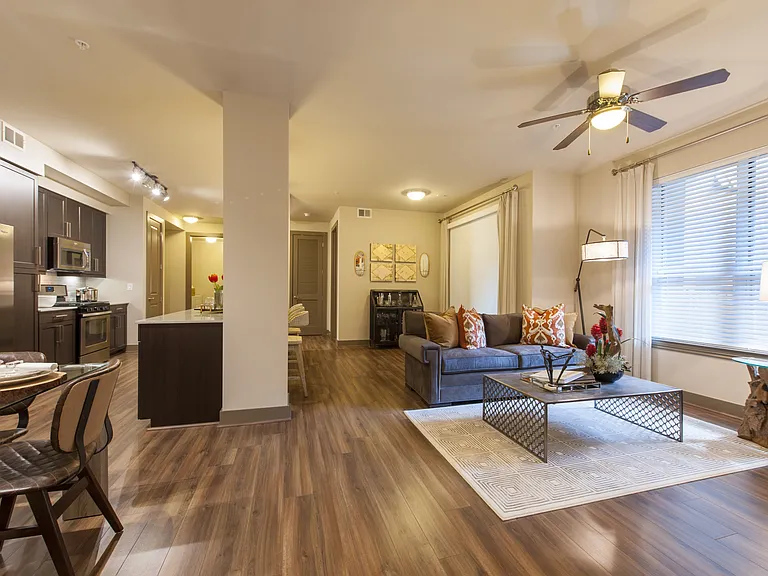 Open-concept layout uniting kitchen, dining, and living areas.