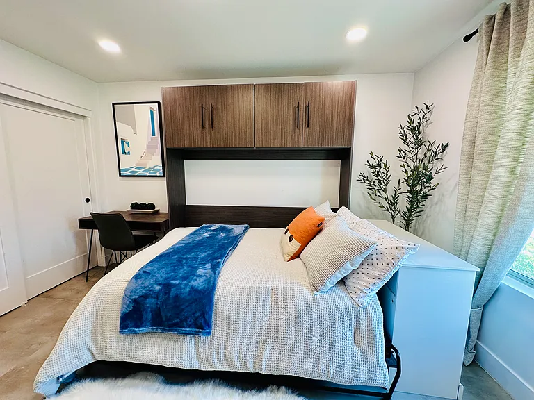 Guest Bedroom 2: 
Versatile Full-size Murphy bed, perfect for maximizing living space during the day.
