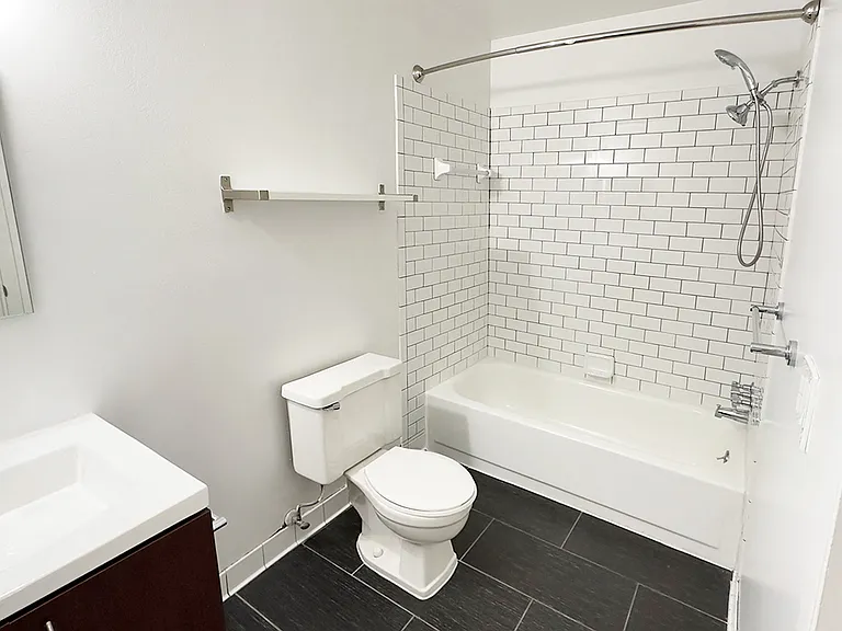 1 or 2 bedroom apartment with newly upgraded bath from black tile to farmhouse sink.