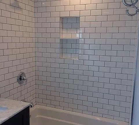 Tub/shower tiled to the sky
