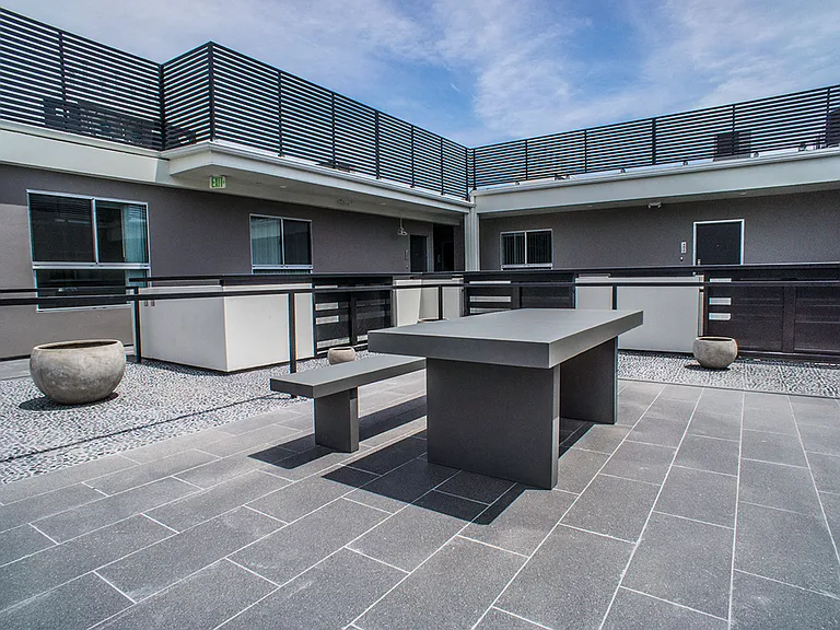 Courtyard Rooftop with Tables and Benches for Entertaining