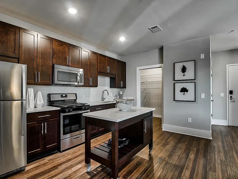 Expansive kitchens with modern cabinetry, and stainless steel appliances