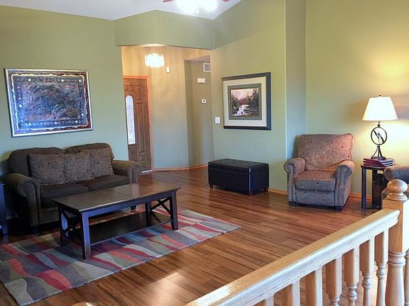 Living Room with hardwood floors and open floor plan.