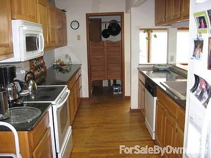 Kitchen main house
						:
						New granite counter tops, looking into pantry and door leading to storm cellar