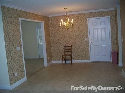 Dining area
						:
						Den is to the left and garage is through the white door