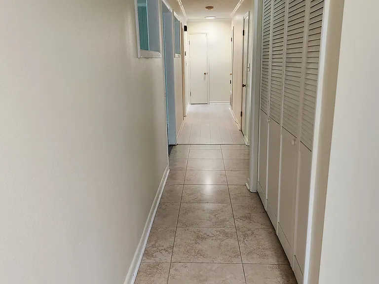 Hallway, bifold doors of laundry area