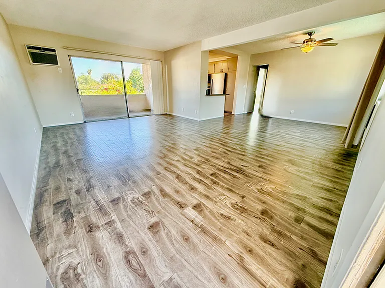 Large, open upstairs unit with wood floors throughout.
