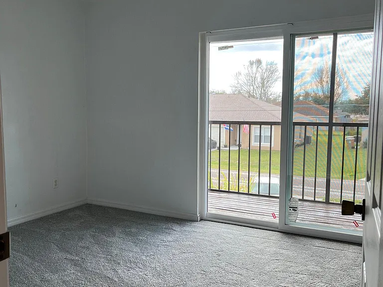 front upstairs bed w balcony