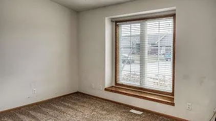 The second bedroom faces the street and has a window seat and a walk-in closet.