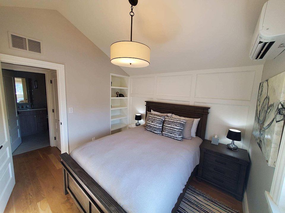 Built-in shelving next to bed