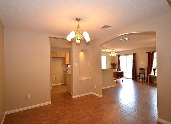 This dining room will easily accommodate a table for eight.