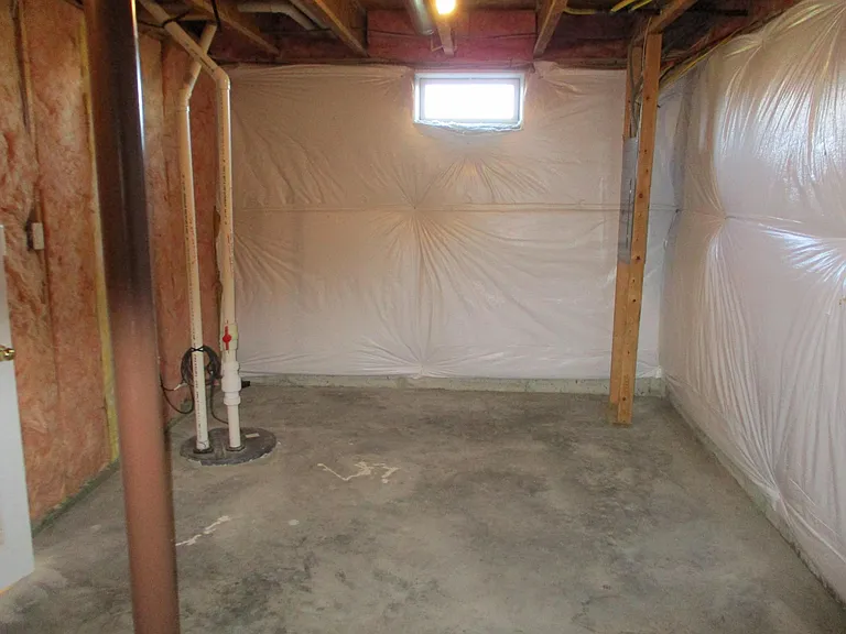 Opposite view of unfinished portion of lower level