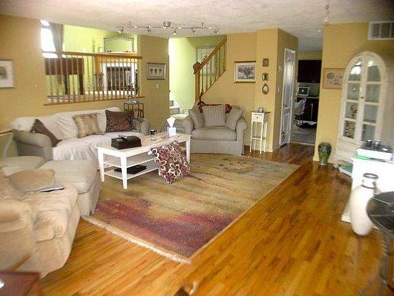 living room with family room or dining room upper left