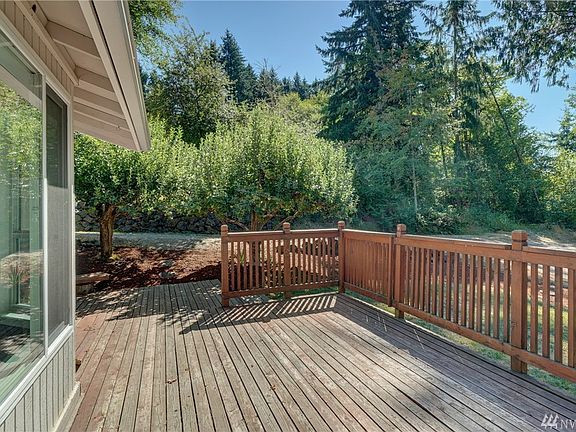 This home is surrounded by mature trees and secluded privacy. 