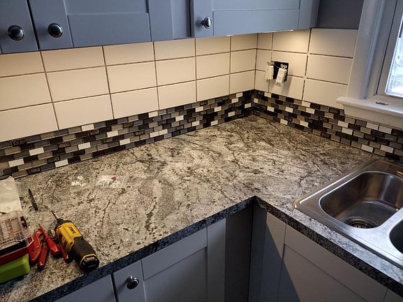 Kitchen includes undercabinet lighting.