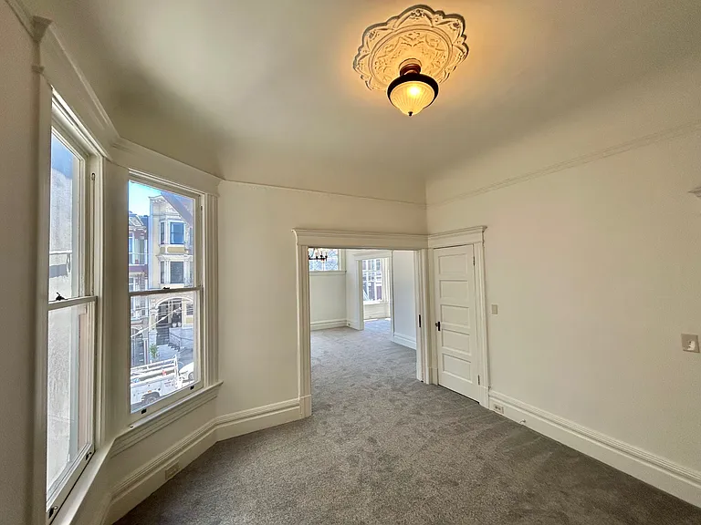 dining room (has closet and there is a sliding door between dining room and living room0
