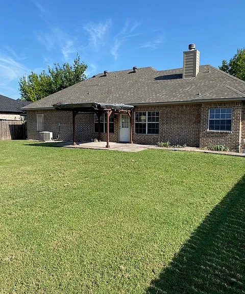 Back of house w/pergola