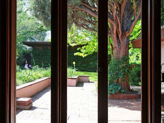 "Mitered window corners connect interior & outdoors, allowing a more intimate experience"