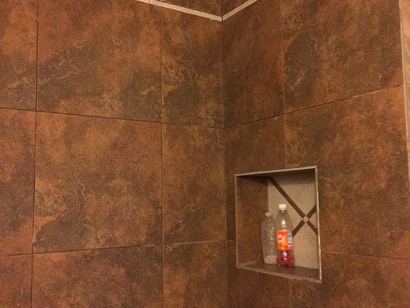 Upgraded tiled walk in shower guest bathroom