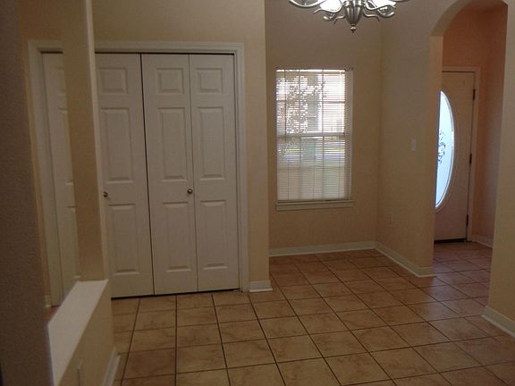 This is a picture of the dining area and the washer and dryer closet (washer and dryer are included. The front entryway is to the right of the window.