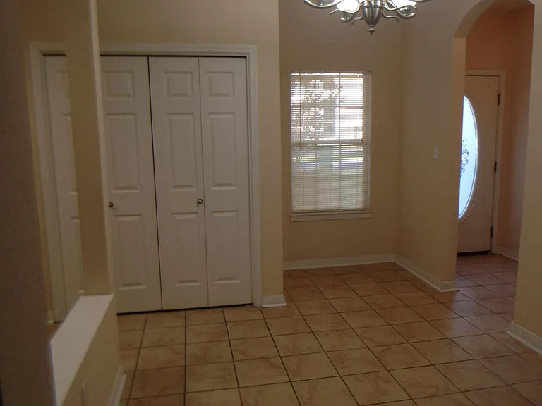 This is a picture of the dining area and the washer and dryer closet (washer and dryer are included. The front entryway is to the right of the window.