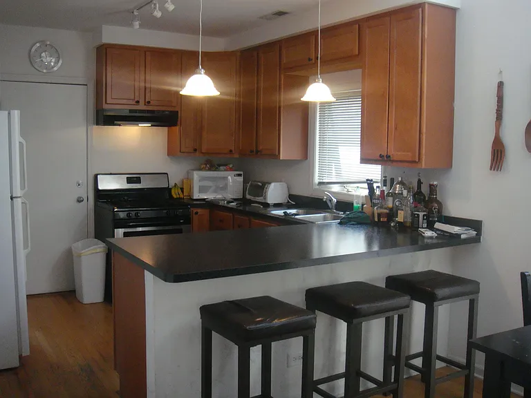 SHARP BREAKFAST ISLAND KITCHEN OPEN TO LIVING AREA IN OPEN MODERN LAYOUT